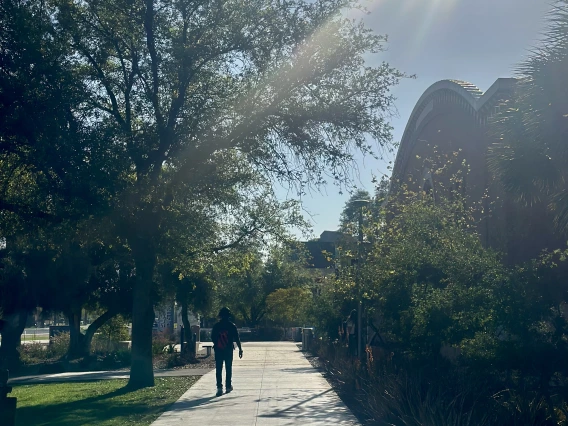 Student Walking by Bear Down 